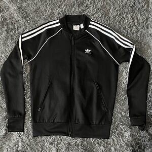 Adidas women’s small track jacket In Black
